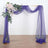 Purple drapery with floral accents for event decor