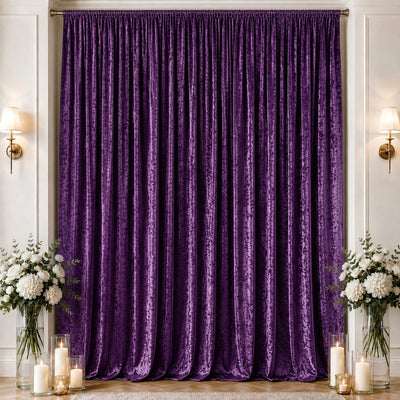 Purple velvet curtain backdrop with candles and floral arrangements, elegant decor