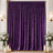 Purple velvet curtain backdrop with candles and floral arrangements, elegant decor