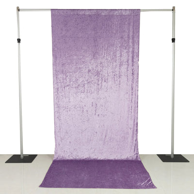 Purple velvet photography backdrop on adjustable stand with floor sweep