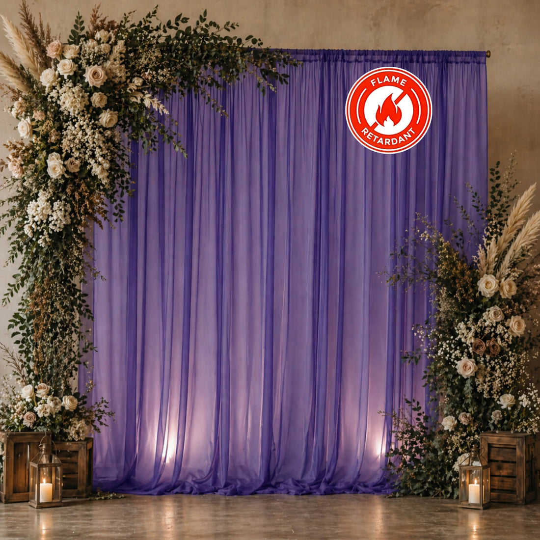 Purple wedding backdrop with floral arch, lanterns, and flamelretardant sign