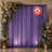 Purple wedding backdrop with floral arch, lanterns, and flamelretardant sign
