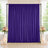 Purple wedding backdrop with floral arrangements and candles on elegant display