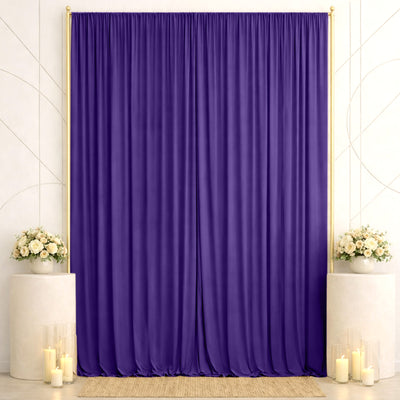Purple wedding backdrop with gold frame, flowers, and candles on pedestals