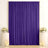 Purple wedding backdrop with gold frame, flowers, and candles on pedestals