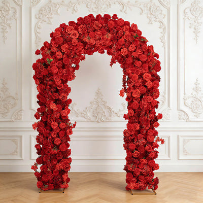 Red floral arch with roses in elegant white ornate room