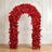 Red floral arch with roses in elegant white ornate room