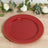 Red decorative plate with gold beading detail on a textured surface.