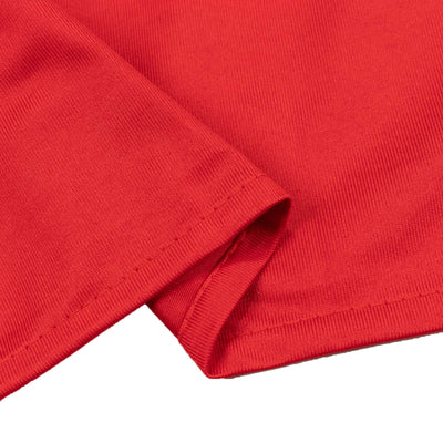 Red ribbed knit fabric close-up with folded hem detail