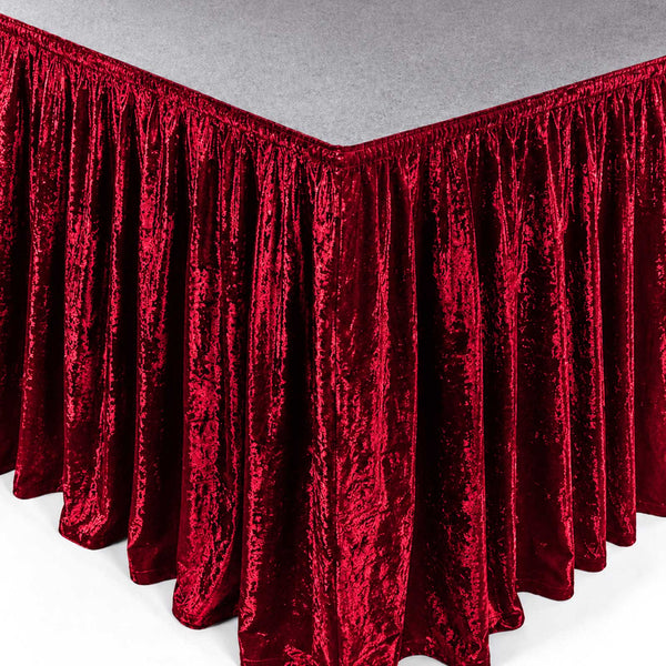 Red velvet corner table skirt with pleated drapes