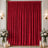Red velvet stage curtain with floral arrangements and candle decor