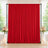 Red wedding backdrop curtain with floral arrangements and candles