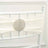 White chair sash with decorative rhinestone embellishment.