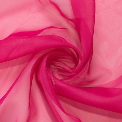 Pink sheer fabric swirling in a spiral pattern. #whtbkgd