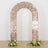 Rose gold sequin arch with floral arrangements at the base