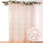 Delicate lace curtain with floral design, shown against a white background.