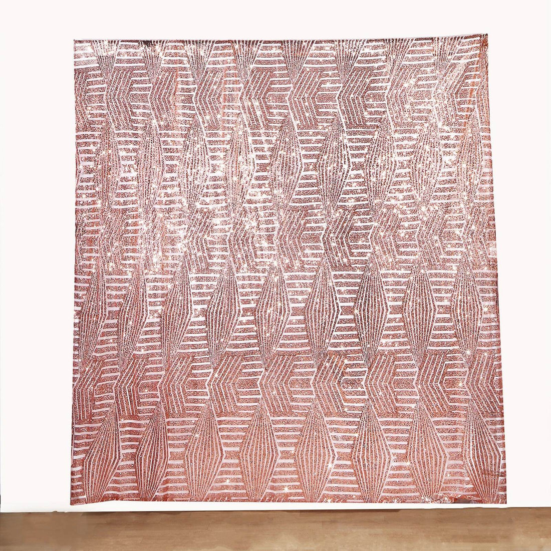 Textured fabric wall hanging with geometric pattern in warm tones