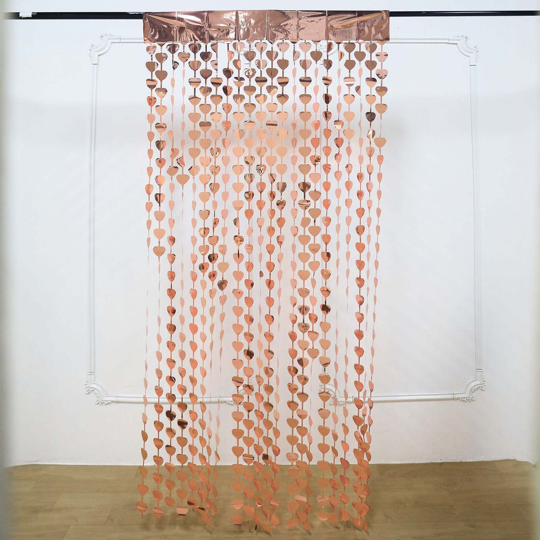 Rose gold heart-shaped garland curtain decoration for events and parties.