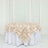 Beige rose-patterned tablecloth on a round table.