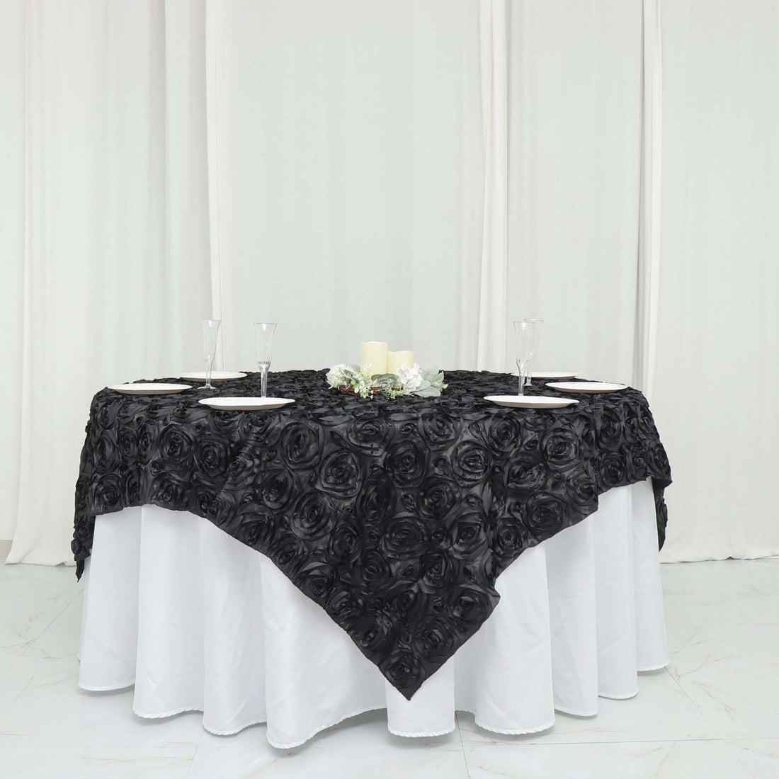 Black rose tablecloth on an elegantly set dining table.