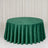 Round green velvet tablecloth on a banquet table with elegant draped backdrop