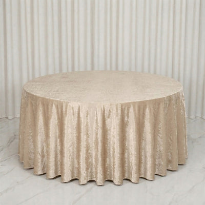 Round table with champagne velvet tablecloth in elegant event setup