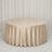 Round table with champagne velvet tablecloth in elegant event setup