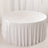 Round table with white velvet tablecloth in elegant minimalist setting