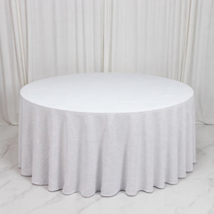 Round white table with textured drape in elegant event setup
