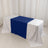 Table with blue and white tablecloths on a plain backdrop.