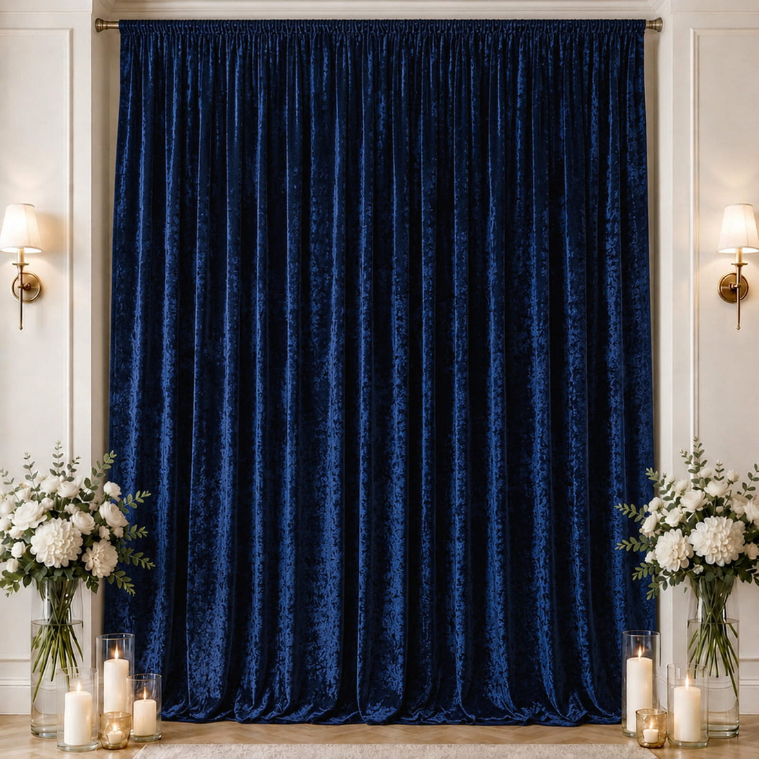Royal blue velvet curtains with elegant floral decor and candlelit decor backdrop