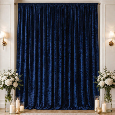 Royal blue velvet curtains with elegant floral decor and candlelit decor backdrop