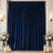 Royal blue velvet curtains with elegant floral decor and candlelit decor backdrop