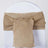 Burlap chair sash tied in a bow on a white chair