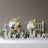 Mr & Mrs decorative letters with floral arrangements on a table setting.