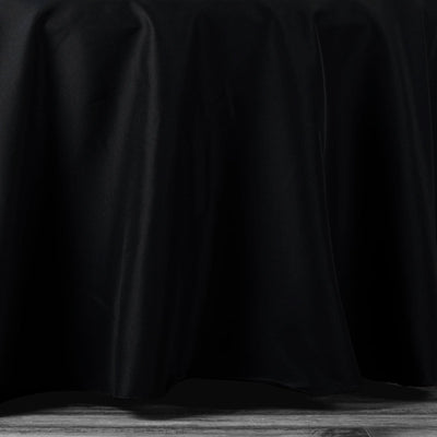 Black tablecloth draping elegantly over a surface.