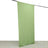 Green fabric backdrop hanging on a rod