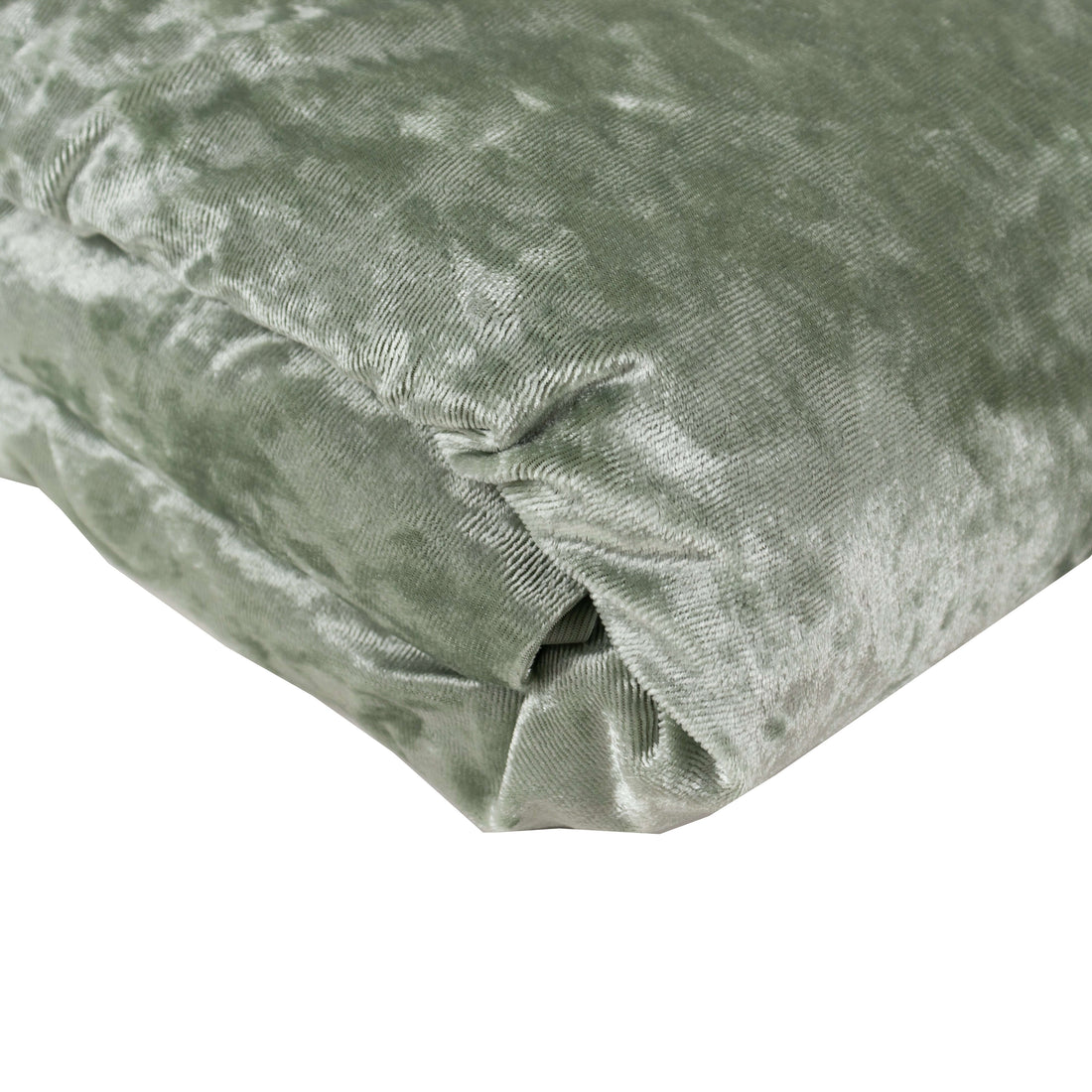 Soft green velvet cushion with a plush texture.