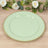 Mint green decorative plate with gold beaded rim on wooden surface.
