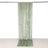 Green velvet curtain draped and hanging in studio-style isolation shot