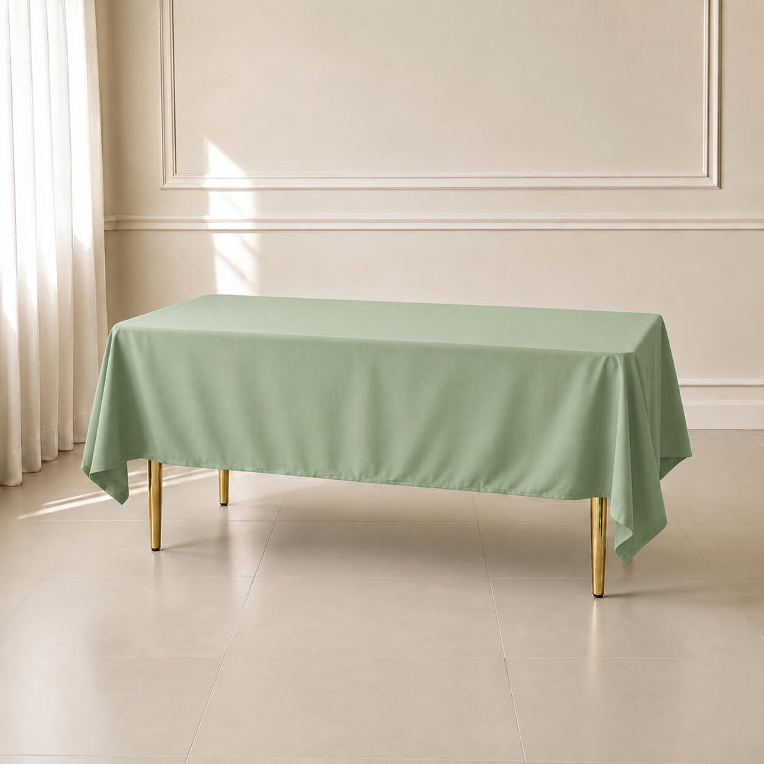 Sage green polyester rectangle tablecloth 60"x102" on a dining table.