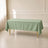 Sage green polyester rectangle tablecloth 60"x102" on a dining table.