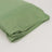Folded green sleeping bag on a plain background.
