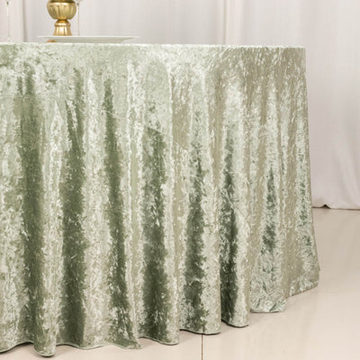 Sage green velvet tablecloth with elegant drape for round table