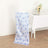 Blue floral chair cover draped over a white chair in a dining setting.