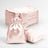 Set of pink satin bags stacked and one bag displayed.