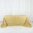 Gold rose-patterned tablecloth on a table.