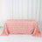 Pink rose-patterned tablecloth on a white background.
