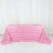 Pink rose-patterned tablecloth on a white backdrop.