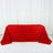 Red rose-patterned tablecloth on a plain backdrop.